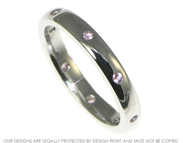 9ct white gold pink sapphire eternity ring. 