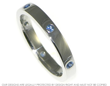 Classic 9ct white gold eternity ring with blue sapphires equally spaced around the band 