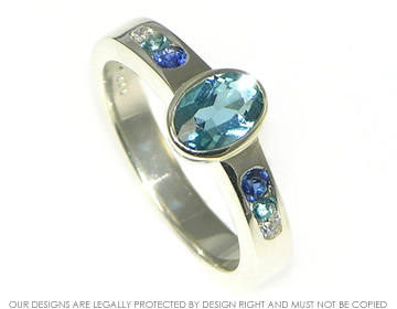 Bespoke white gold engagement ring with topaz, sapphire and diamond