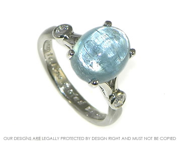 Platinum and oval cabochon cut Aquamarine with  diamonds