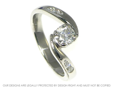 Platinum 0.56ct G SI1 diamond engagement ring with shoulder diamonds