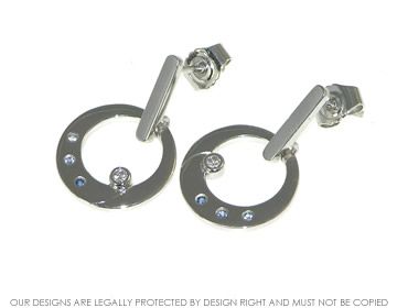 18ct white gold earrings with diamonds and blue sapphire. 