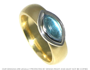 An 18ct gold  cabochon cut topaz engagement ring with an interesting setting