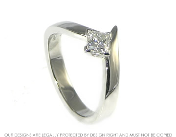 Platinum engagement ring with princess cut diamond. 