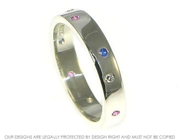 9ct white gold scatter set sapphire eternity ring.