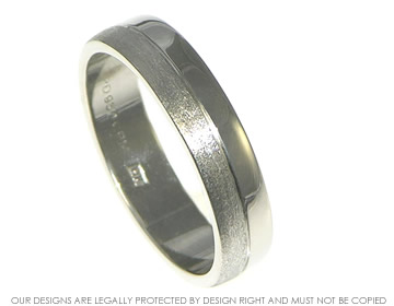 Palladium flat wedding band with a tunstall and polished finished.