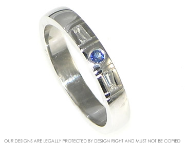 18ct white gold band with tapered baguette diamonds totalling 0.09cts and a 2mm blue sapphire. 