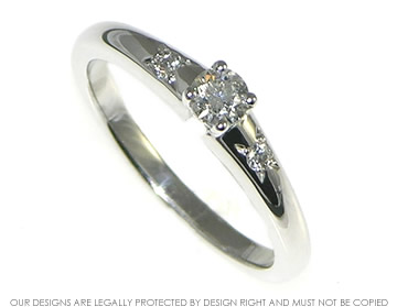 18ct white gold engagement ring with brilliant cut central and shoulder diamonds.