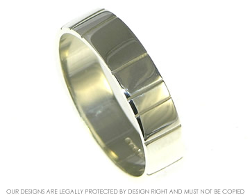 9ct white gold mans wedding ring with engraved line detail.