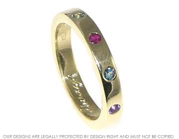 9ct gold ring with 2mm topaz,ruby, amethyst and alexandrite.