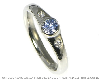 Platinum engagement ring with 0.30ct blue sapphire and diamonds