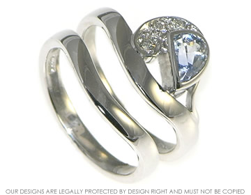 Crest of a wave inspired sapphire and diamond engagement and wedding ring set