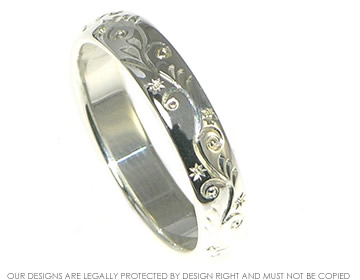 Engraved sterling silver wedding band.