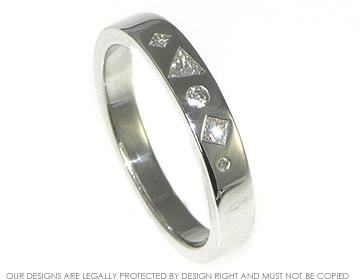 18ct white gold ring with unusual geometric scatter set diamonds 

