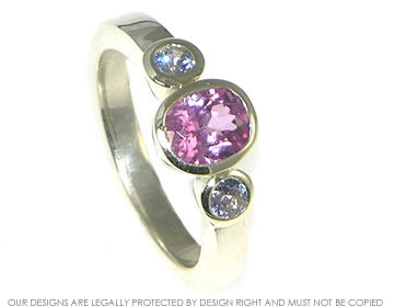 Bespoke 9ct white gold dress ring with pink and lilac sapphires.