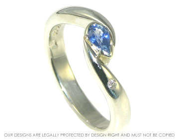 9ct white gold engagement ring with pear shaped blue sapphire and brilliant cut diamond.