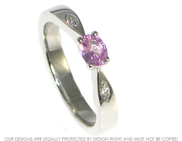 Delicate 9ct white gold oval pink sapphire and diamond engagement ring. 