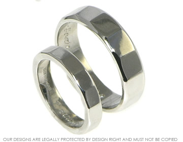 Bespoke his and her platinum wedding rings.