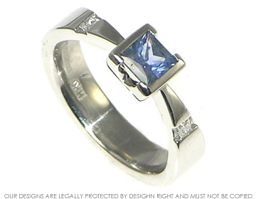 Bespoke platinum engagement ring with blue sapphire