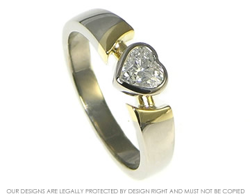 Heart shaped mixed metal engagement ring inspired by Celtic Claddagh rings