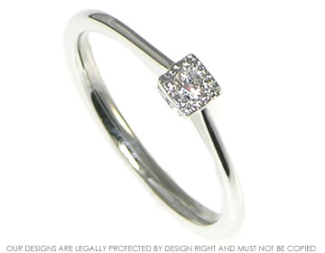 Very delicate looking 9ct white gold and  diamond engagement ring