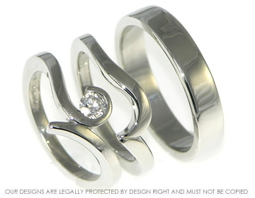 A pair of bespoke platinum wedding rings. 