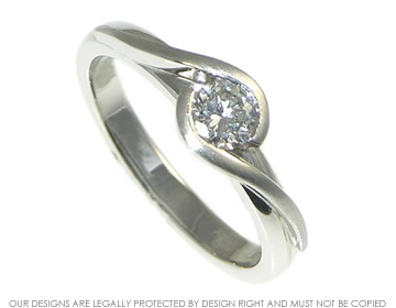 Platinum and diamond twist style solitaire engagement ring