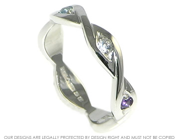 Platinum celtic design ring with a 2mm brilliant cut aqua, 2mm white sapphire and a 2mm amethyst in marquise grain setting.