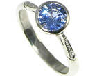 antique styled platinum engagement ring with cornflower blue sapphire