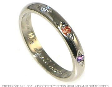 18ct white gold eternity ring with amethyst, orange and blue sapphire.