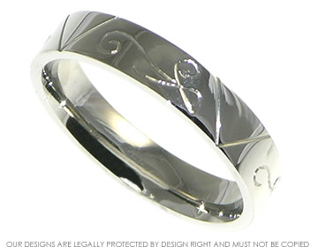 Palladium commitment ring with engraving detail and a polished finish.