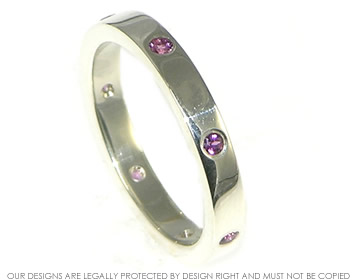 Bespoke 9ct white gold ladies garnet eternity ring. 