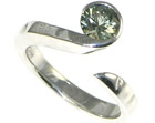 bespoke 9ct white gold wave inspired engagement ring with 5.9mm brilliant cut green sapphire