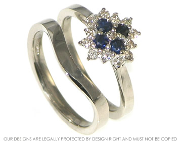 A sapphire and diamond 18ct white gold engagement and wedding ring.