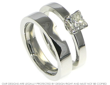 Platinum ladies shaped wedding ring with a polished finish. 