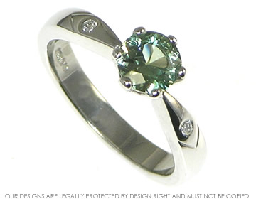 Platinum engagement ring with a 0.84ct green sapphire 