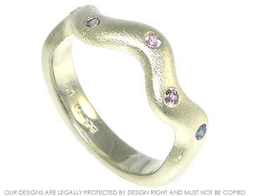 Bespoke 9ct white gold wedding ring with graduated coloured sapphires. 