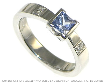 Bepoke platinum engagement ring with princess cut 0.61ct sapphire and H SI diamonds totaling 0.03cts.