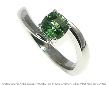 Platinum twist engagement ring with green tourmaline.