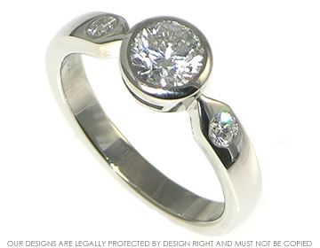 0.79ct diamond engagement ring incorporating two of the custromer's own stones.