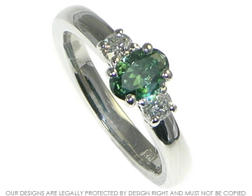 Bespoke platinum engagement ring with a forest green heat-treated diamond.