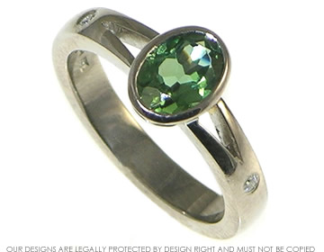 18ct white gold engagment ring with a green tourmaline.