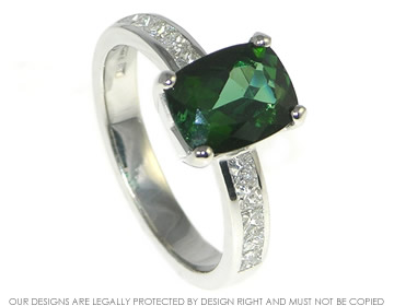 Bespoke 18ct white gold engagement ring with 9x7mm cushion cut deep green tourmaline and ten 2mm princess cut H SI diamonds.