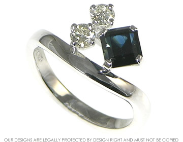 Dress Ring in 9ct white gold, claw set with diamond and sapphire. 