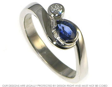 Bespoke palladium twist style sapphire and diamond engagement ring.