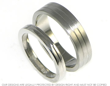 Palladium wedding band with two engraved lines.