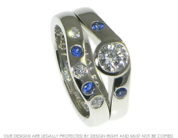 Platinum fitted wedding band with sapphires and diamonds. 