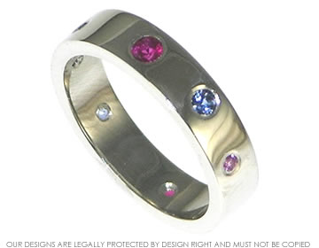 Petra's eternity ring was scatter set with sapphires and rubies