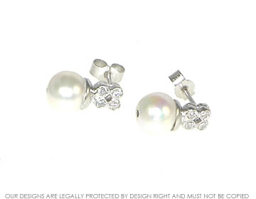 18ct white gold diamond and pearl earrings.