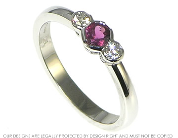 Platinum oval/cushion cut ruby and diamond engagement ring 